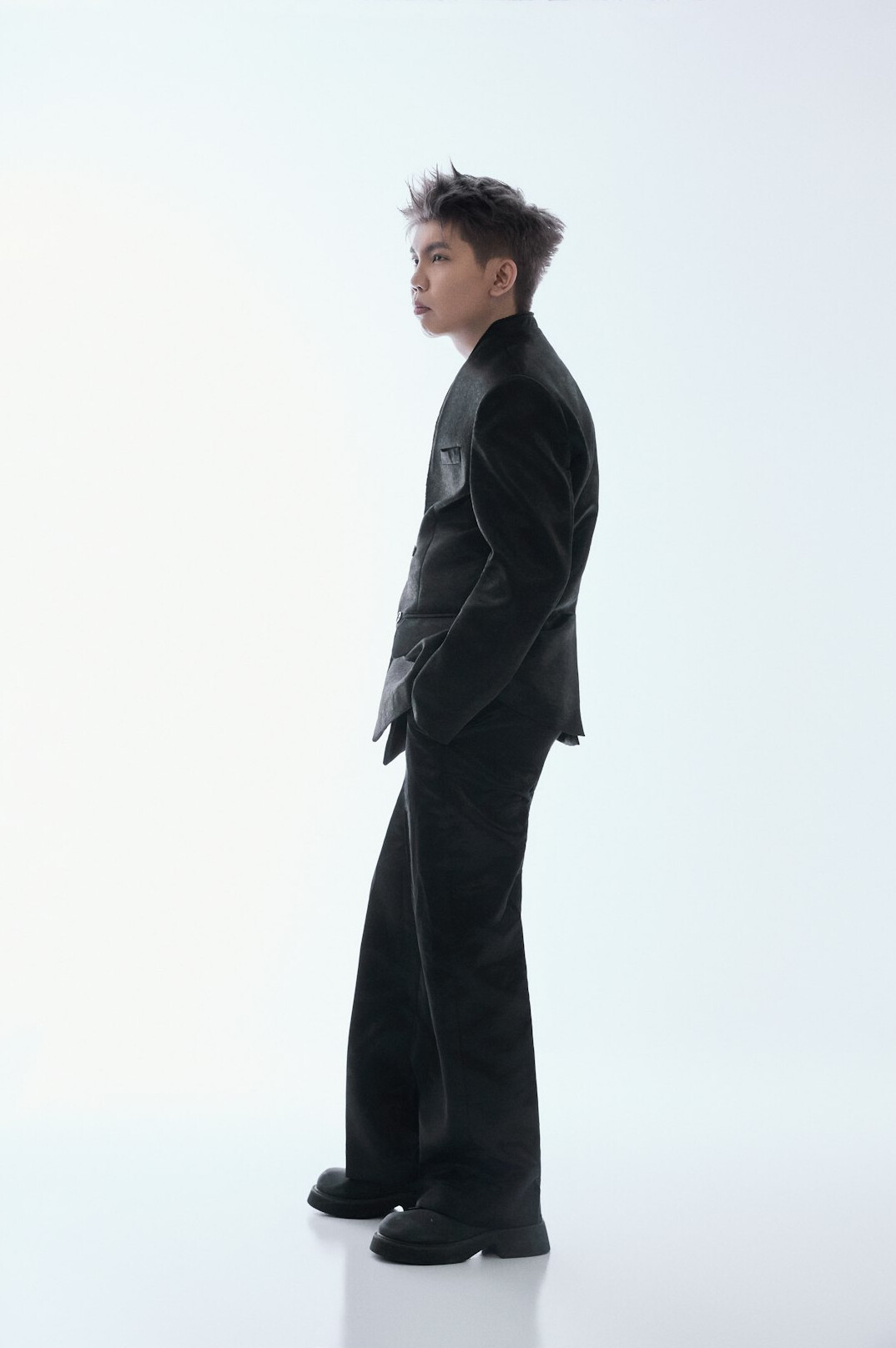 Studio photo of a middle-aged man in a suit