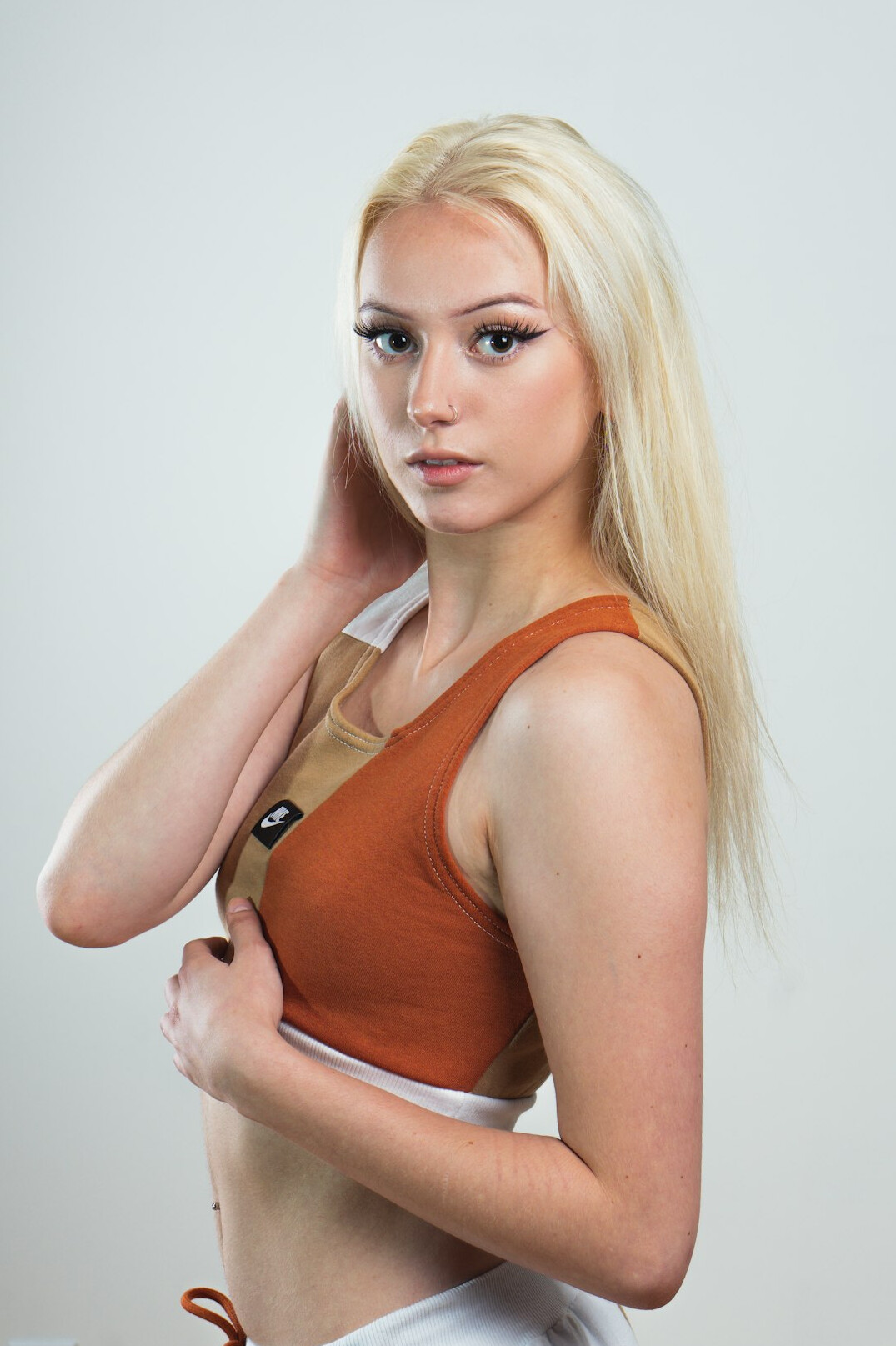 Studio photo of a young woman with blonde hair
